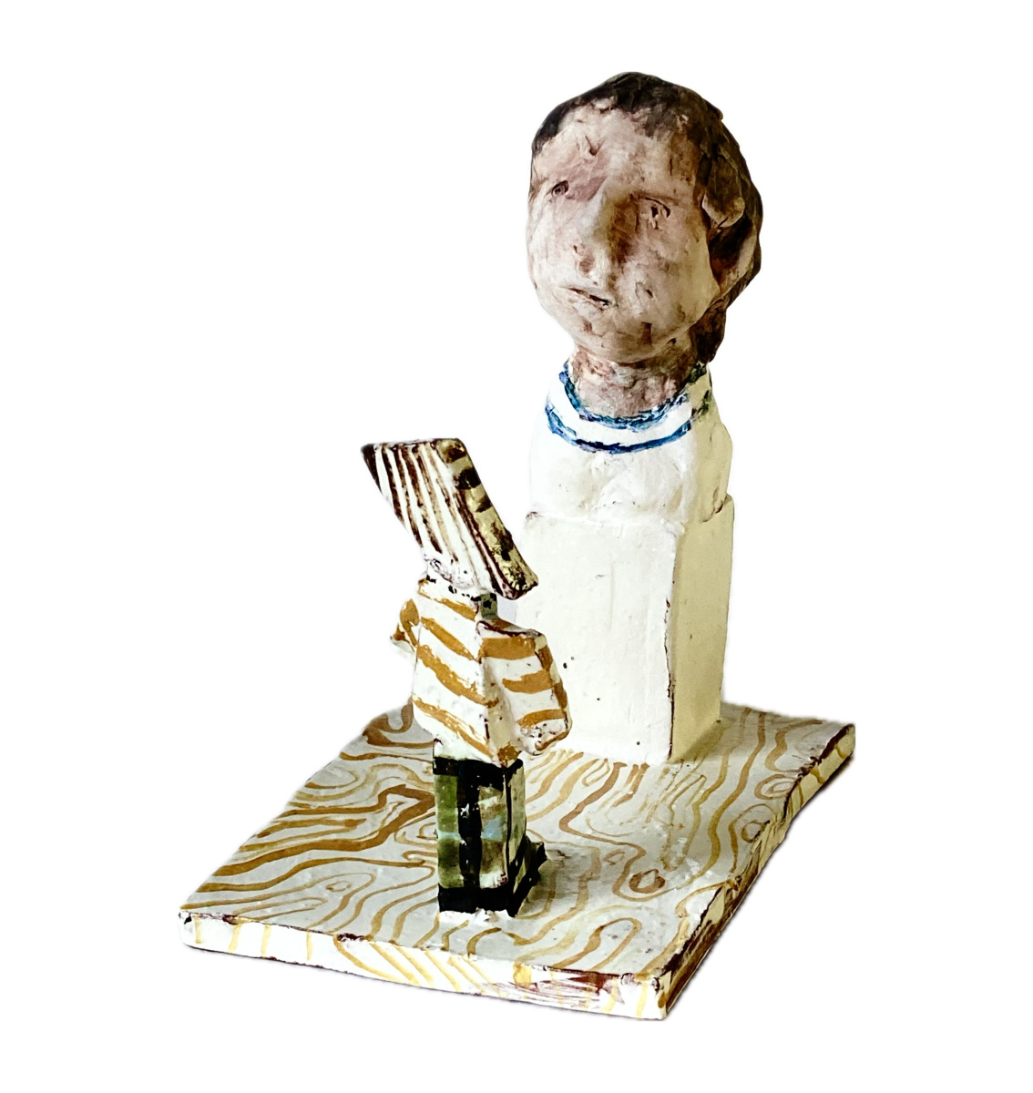 Cubist child looks at head Hand modelled torso on plinth with slab built viewer. Earthenware with painted oxides and clear glaze