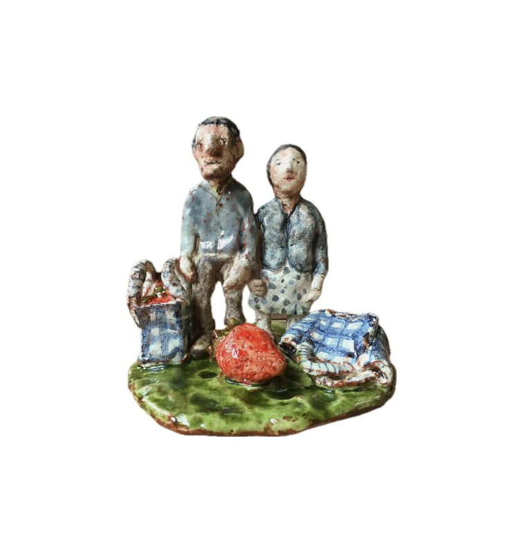 Strawberry pickers Earthenware hand built figures on green base with checked bag and giant strawberry