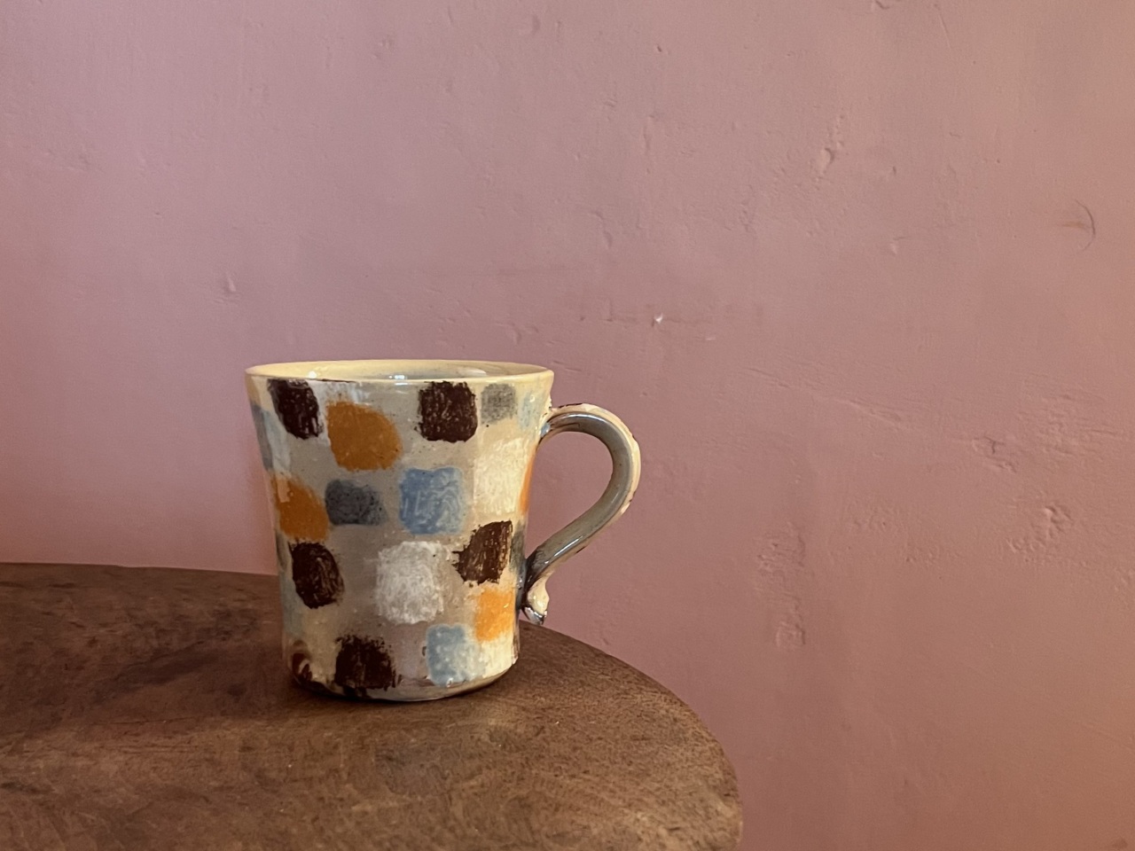 handmade mug with coloured squares pattern